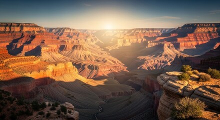 Sunrise over Grand Canyon with layers of rock formations  