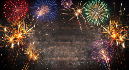 Christmas Fireworks Display on Wood Texture. Festive Background with Fireworks.

