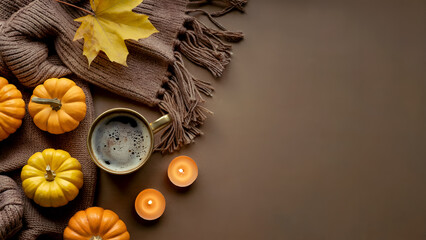Cozy Autumn Flatlay with Pumpkins, Coffee, Blanket and Candles on Brown Background