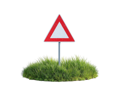 PNG of A cautionary traffic sign on a grassy mound, signaling drivers to be vigilant of potential hazards ahead.