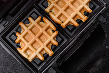 Belgian waffles, a healthy sweet breakfast dessert, food background. Belgian waffles