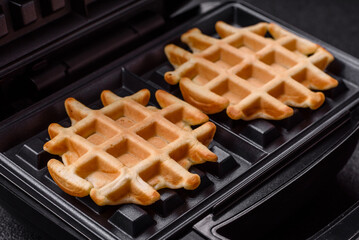 Belgian waffles, a healthy sweet breakfast dessert, food background. Belgian waffles