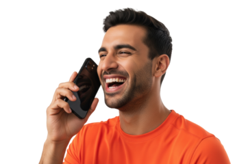 a handsome youthful middle eastern man in a bright orange athletic t-shirt laughs heartily while holding a black smartphone, isolated on a white studio background with copy space, genuine joy and
