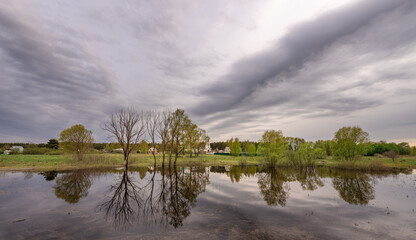 Cloudy sky with a lake in the foreground