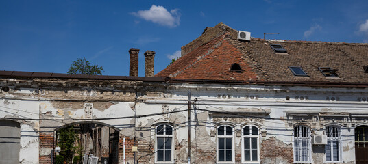 Building with a white roof and red tiles