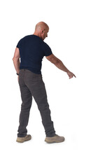 Naklejka premium man standing pointing down on white background
