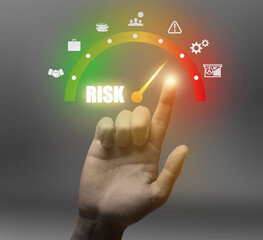 Man regulating level of risk on virtual screen against grey background, closeup