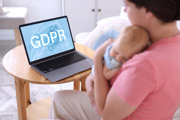 General Data Protection Regulation. Mother and her baby with pixelated faces indoors. Woman using laptop with GDPR on screen. Privacy security