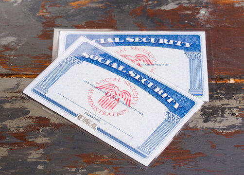 Moscow, Russia, 11.28.2025. An American social security document against the backdrop of the US flag.