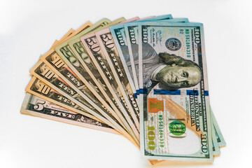 New dollar banknote USA of different denominations folded like a fan.  White background, isolated.