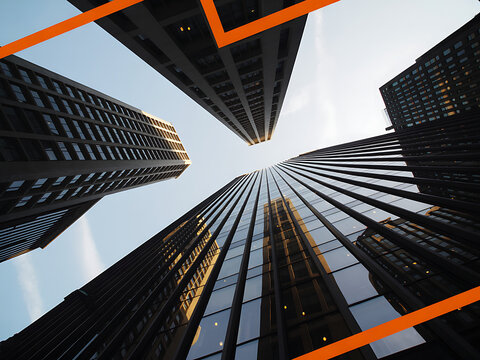Low angle view of modern glass skyscrapers against clear sky with orange lines