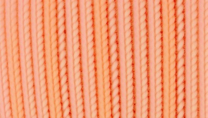 A close up of a beautiful peach colored braided rope texture background with repeating pattern for design