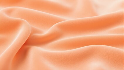 Elegant peach colored silk fabric with soft flowing waves and delicate texture for fashion design