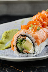 A close-up view of sushi topped with silky salmon revealing fine texture rich color and delicate freshness.