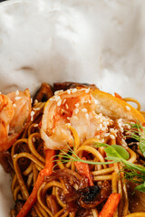 Creamy pasta mixed with fresh shrimp and assorted seafood, served in an appetizing close-up that highlights rich textures and vibrant colors.