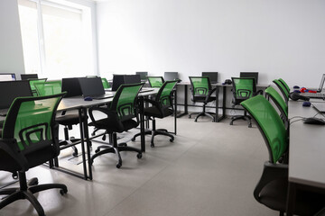 Computer science class with laptops at school