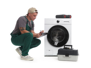 Repairman in uniform with clipboard, toolboxes and washing machine on white background