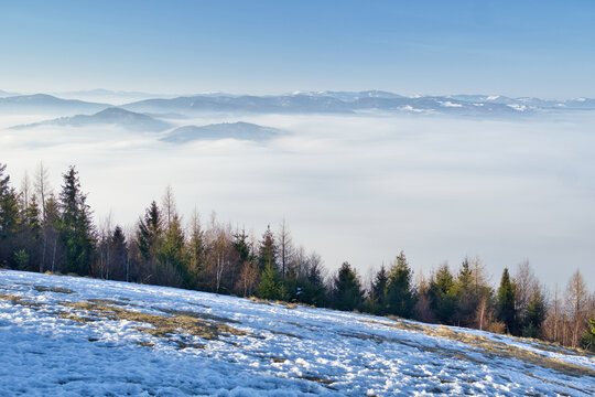 Aerial view of the serene landscape with a blanket of fog rolling over the mountains, Slubica mountain, Spisska nova Ves, Kosicky kraj, Slovakia.