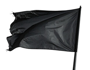 Close-up of a black flag billowing in the wind against a black background