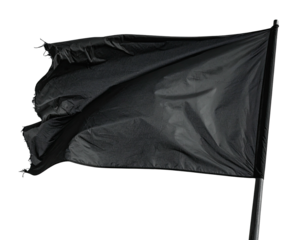 Close-up of a black flag billowing in the wind against a black background