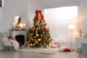Blurred view of stylish room with Christmas tree and festive decor