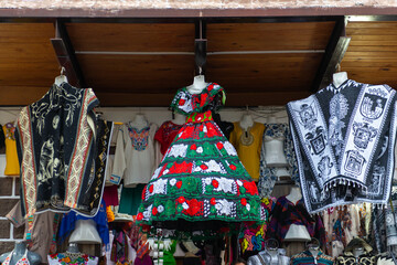 Colorful Traditional Mexican Dress and Poncho on Display at Market Stall