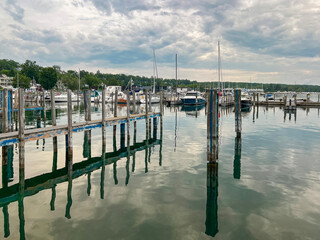 Beautiful bay of water on Lake Michigan with a variety of large and small boats in the harbor.  Located on Little Traverse Bay in Northern Michigan, USA.