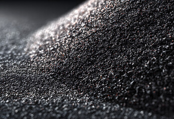 Dark grainy black texture featuring subtle speckling and worn frayed edges, a versatile background for graphic design, presentation slides, branding concepts, and digital artwork