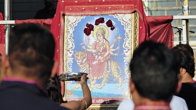 Devotees worshiping Durga goddess image during Navaratri festival in India