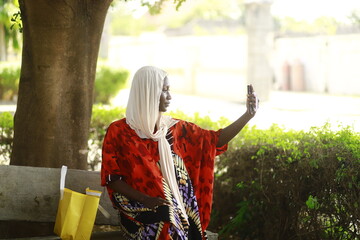 young african lady using smartphone