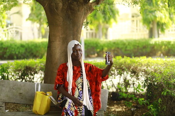 young african lady using smartphone