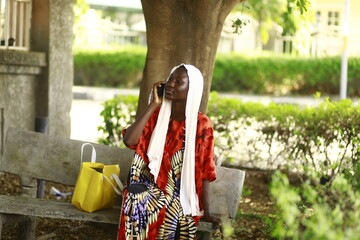 young african lady using smartphone