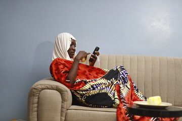 young african lady using smartphone