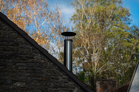 Wood Burner flue terminal sited on a sloping roof