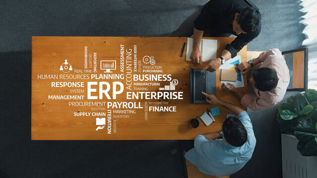 A professional meeting focused on effective business planning using ERP solutions. The image showcases collaboration among team members in a modern workspace setting. Amity - Powered by Adobe