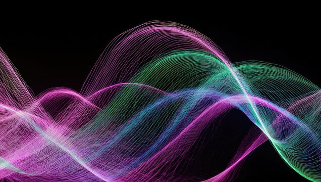 Abstract waves of light in vibrant colors on black background.