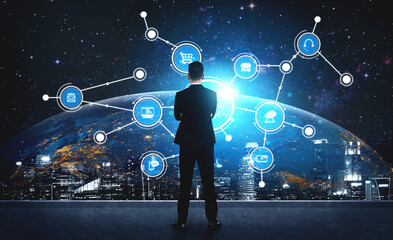 A businessman stands confidently in front of a digital interface that represents technological advancements and innovation over a futuristic cityscape at night. Tessel