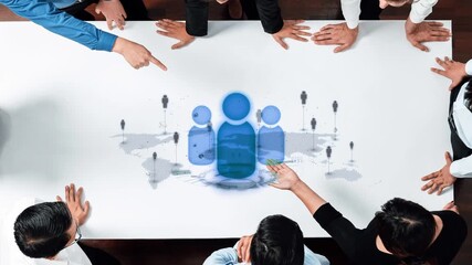 A diverse group of professionals collaborates around a table, utilizing digital elements to symbolize teamwork and connection in a dynamic business environment. Raster - Powered by Adobe