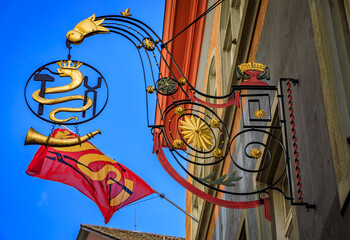 Historic ornate wrought iron smiths guild sign with a snake, Zurich, Switzerland