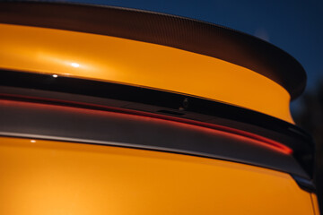 Modern car rear taillight lamp close-up view. The clean trunk of modern car