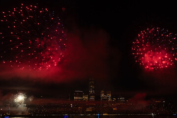 Fototapeta premium New York Manhattan fireworks. New York Fireworks over Manhattan. New York City 4th of July Fireworks. New York City Skyline Manhattan with Flashing Fireworks. Independence day.