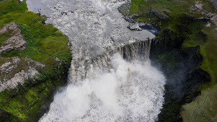 Aerial view of Hafragilsfoss  waterfall, located along the river Jokulsa, falls from a height of 27 metres over a width of 91 metres.