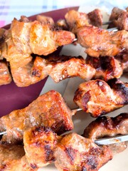 Close-up of juicy meat shashlik cooked on the grill