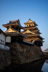 Fototapeta premium Nakatsu Castle (Ōita) and Moat at Golden Hour