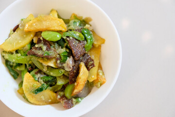 Rinuak fish jerky (endemic fish from Maninjau Lake) cooked with green chili sauce, stinky beans and potatoes