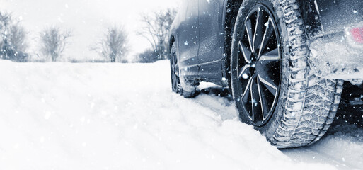 Car on snowy country road, closeup. Adverse weather conditions © New Africa
