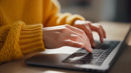 Focused individual typing on a laptop keyboard, showcasing modern remote work, online learning, or digital content creation - Powered by Adobe