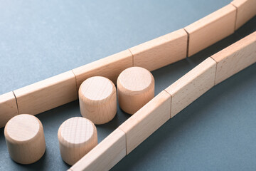 Naklejka premium Wooden blocks forming a bottleneck to illustrate constraints and process limitations