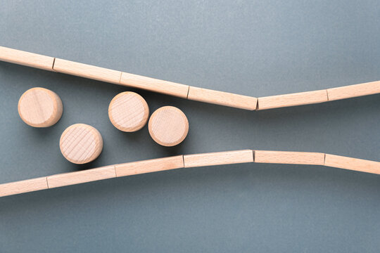 Wooden blocks forming a bottleneck to illustrate constraints and process limitations
