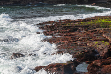 waves crashing on rocks